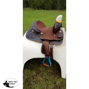 10" Double T  Pony hard seat barrel style saddle with turquoise buckstitch trim.